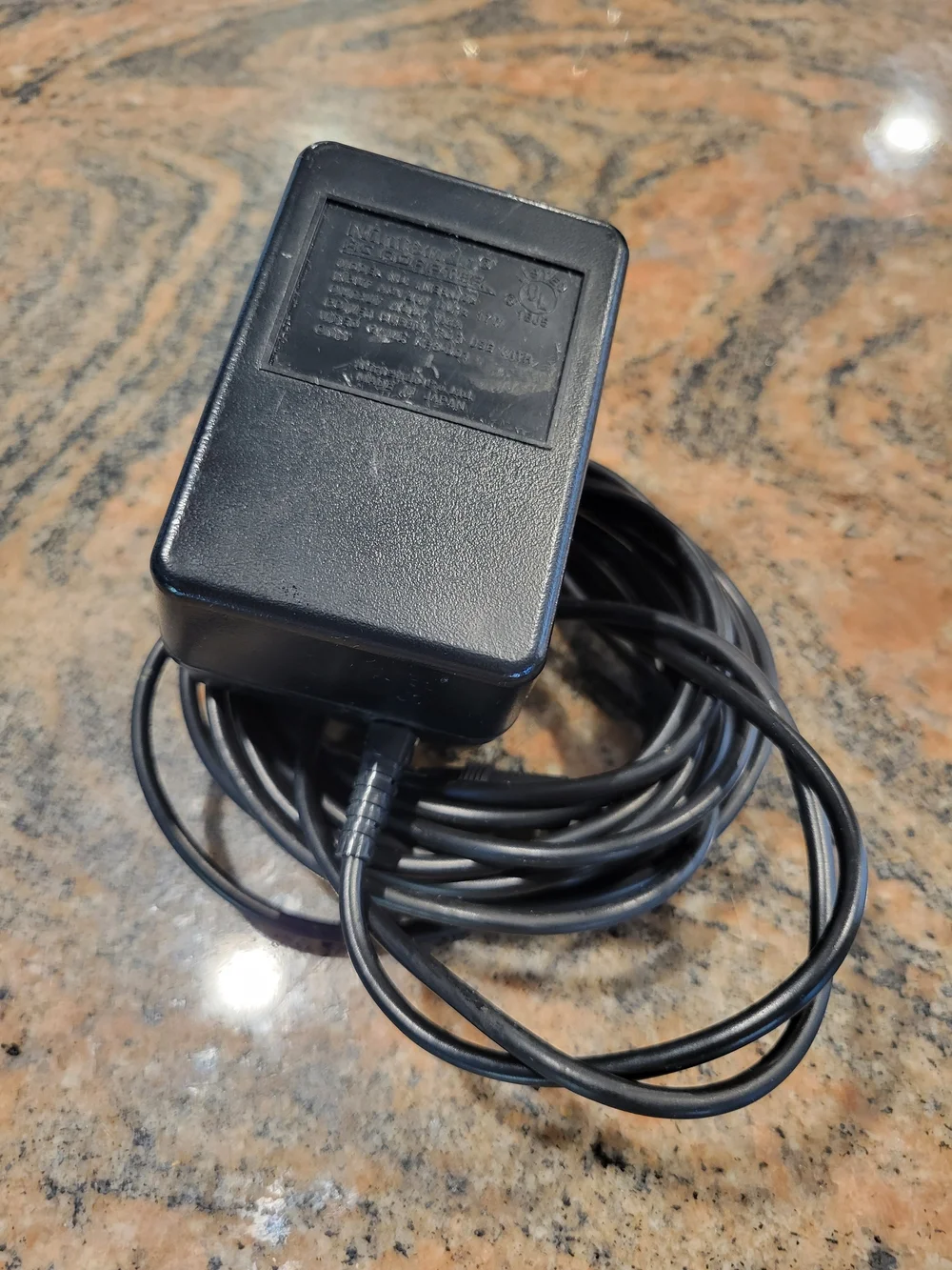 Official Nintendo AC Adapter. Black plastic exterior. Standard Power Cord. $13
